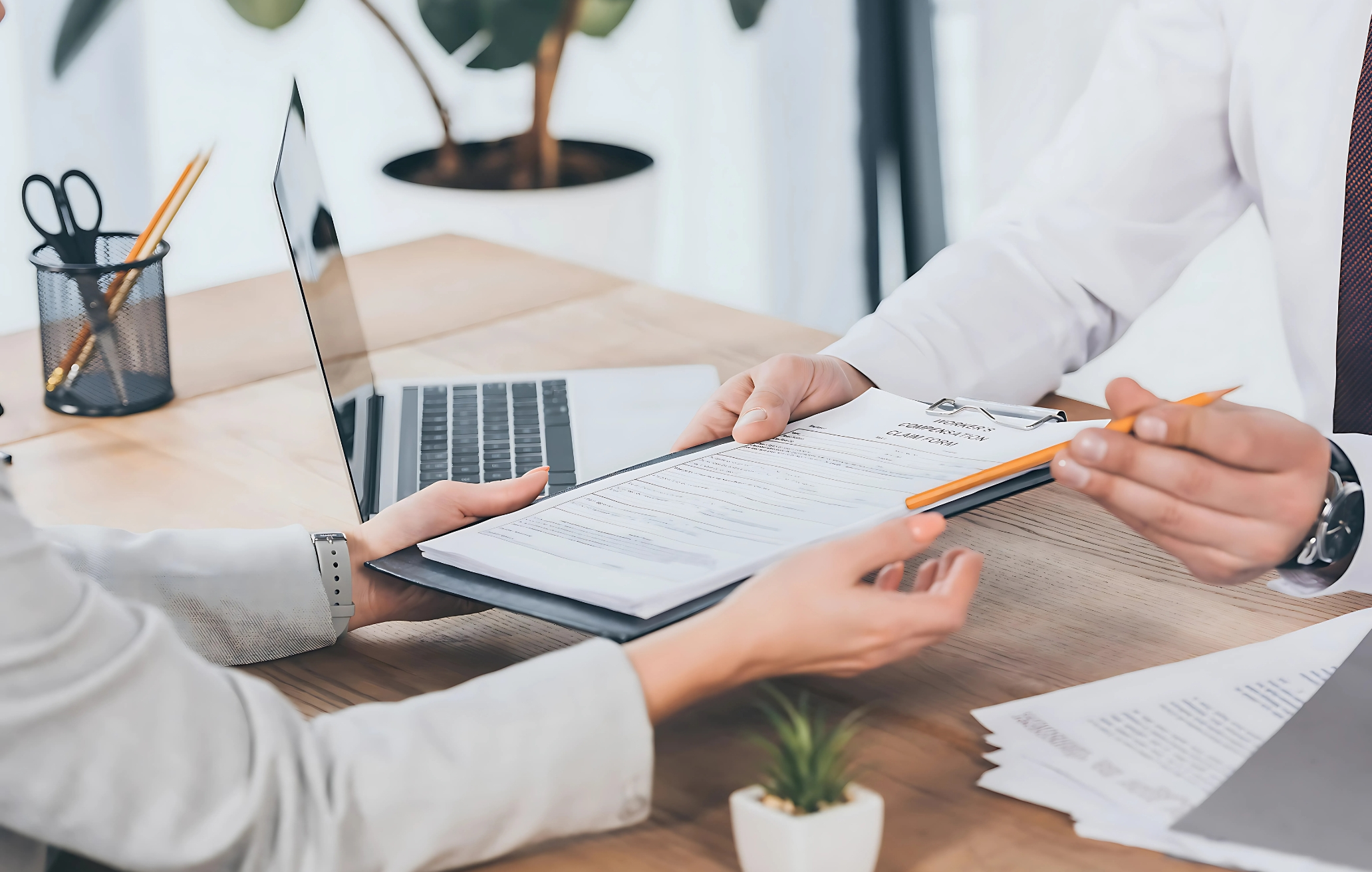 Restaurant Insurance Compliance Checklist Restaurant owner signing an insurance document at a desk